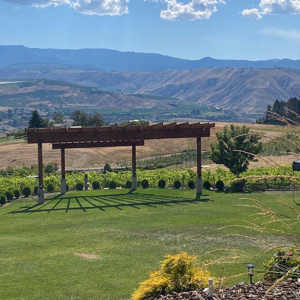 Bianchi Vineyards - a view of a vineyard from a hill - Wineries Near Me - East Wenatchee, Washington Bianchi Vineyards - a view of a vineyard from a hill - Wineries Near Me - East Wenatchee, Washington