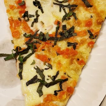 Home Slice Pizza - Margarita Slice (no tomato sauce on it but it has diced tomatoes) - Pizza Near Me - Austin, Texas