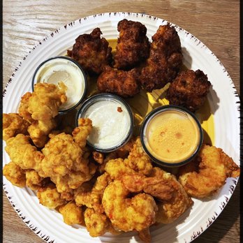 The Salty Mule - Conch fritters ( upper half), bang bang shrimp, and alligator tail. All three delicious choices. - Seafood Near Me - Canton, Georgia