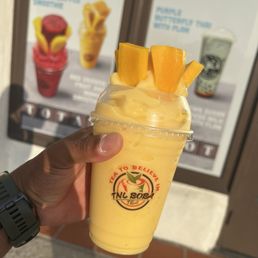 Mango smoothie with fresh slices of mango