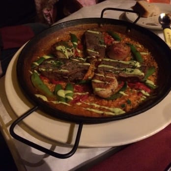 Barcelona - Paella de Costillas y Vieiras - with braised beef short ribs and scallops - Spanish Near Me - Columbus, Ohio Barcelona - Paella de Costillas y Vieiras - with braised beef short ribs and scallops - Spanish Near Me - Columbus, Ohio