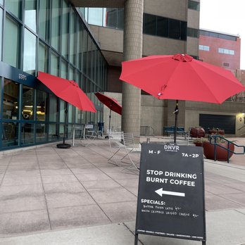 The DNVR Coffee Co - red umbrellas in front of a building - Coffee & Tea Near Me - Denver, Colorado The DNVR Coffee Co - red umbrellas in front of a building - Coffee & Tea Near Me - Denver, Colorado