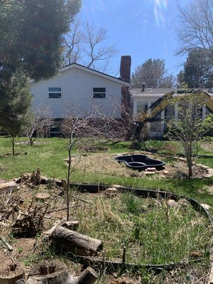 Martin - This was a fun project. Martin bought this house and the landscaping was in major need of attention. He decided to get rid of all of the existing material and start fresh. We took out the grass, bushes, pavers, and ponds, directed drainage away from the house, and regraded the entire yard. Martin - This was a fun project. Martin bought this house and the landscaping was in major need of attention. He decided to get rid of all of the existing material and start fresh. We took out the grass, bushes, pavers, and ponds, directed drainage away from the house, and regraded the entire yard.