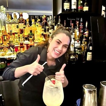 Il Tinello - Arta, cheerfully crafting a Prosecco Spitzer. - Italian Near Me - New York, New York