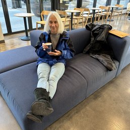 Relaxing with an oatmilk latte. Relaxing with an oatmilk latte.