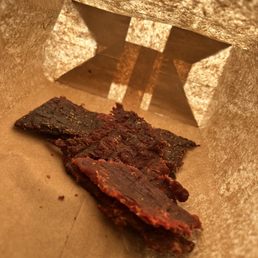a piece of meat in a paper bag