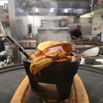 El Barco - a pan of food on a cutting board - Seafood Near Me - Staunton, Virginia