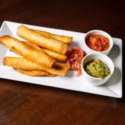 Room 9100 - CHICKEN TINGA FLAUTAS - 5 crispy rolled flour tortillas filled with braised chicken tinga, served with guacamole, salsa & pickled red onion