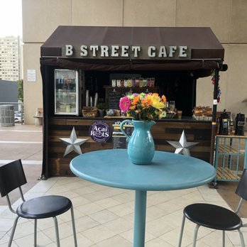 B Street Cafe - a blue table with a vase of flowers - Coffee & Tea Near Me - San Diego, California B Street Cafe - a blue table with a vase of flowers - Coffee & Tea Near Me - San Diego, California
