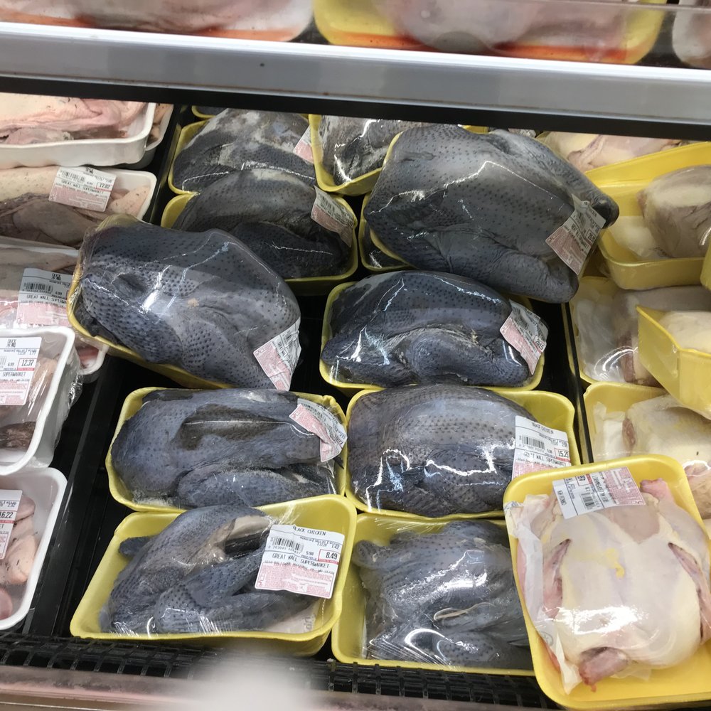 GW Supermarket - a display of raw chicken in plastic containers - International Grocery Near Me - Catonsville, Maryland GW Supermarket - a display of raw chicken in plastic containers - International Grocery Near Me - Catonsville, Maryland