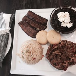 Rice, black beans, arepitas, mashed steak. Rice, black beans, arepitas, mashed steak.