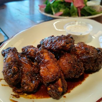 Publican Tavern - Sticky chicken wings for $16 and a $16 salad in the background - New American Near Me - Chicago, Illinois Publican Tavern - Sticky chicken wings for $16 and a $16 salad in the background - New American Near Me - Chicago, Illinois
