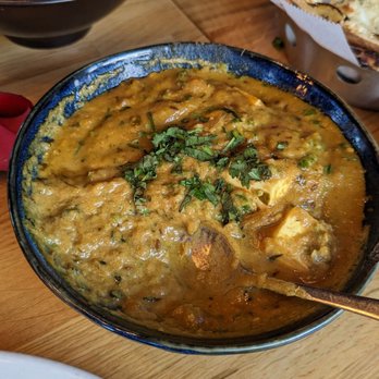 The Yellow Chilli Tustin - Paneer dish in the front, fish Tikka on the left, dhal in the back, and garlic naan on the right - Indian Near Me - Tustin, California