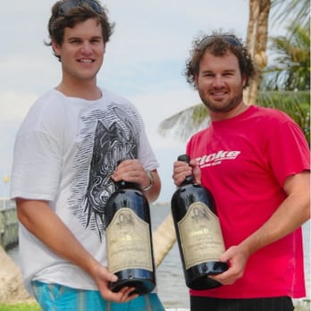 Roy's Liquors - two men holding bottles of wine - Beer, Wine & Spirits Near Me - Fort Pierce, Florida Roy's Liquors - two men holding bottles of wine - Beer, Wine & Spirits Near Me - Fort Pierce, Florida