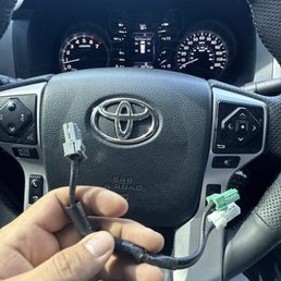 Left under the center console directly next to the gear shifter. Stupidity at its finest.
