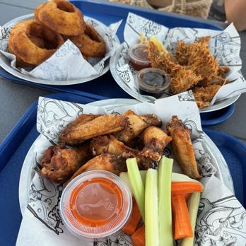 The New Custom House - Chicken wings, onion rings and coconut shrimp - New American Near Me - Avila Beach, California The New Custom House - Chicken wings, onion rings and coconut shrimp - New American Near Me - Avila Beach, California