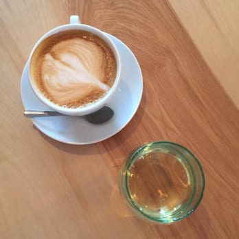 The Shop - Latte art and a glass of moscato - Cafes Near Me - Binghamton, New York