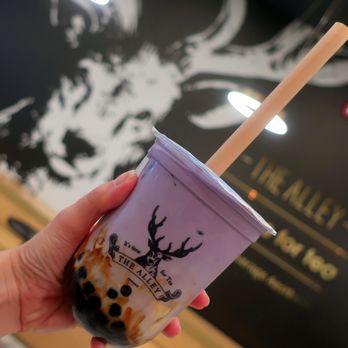 The Alley - a hand holding a cup of bubble tea - Bubble Tea Near Me - Edmonton, Alberta The Alley - a hand holding a cup of bubble tea - Bubble Tea Near Me - Edmonton, Alberta