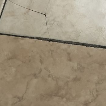 Heron House Court - Broken tile in room - Hotels Near Me - Key West, Florida
