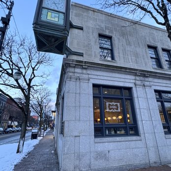 The Quincy Exchange - the clock on the corner of the building - New American Near Me - Corning, New York
