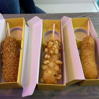 Mochinut - Korean corn dogs (from L to R): crunchy ramen, potato, original. - Donuts Near Me - Worcester, Massachusetts