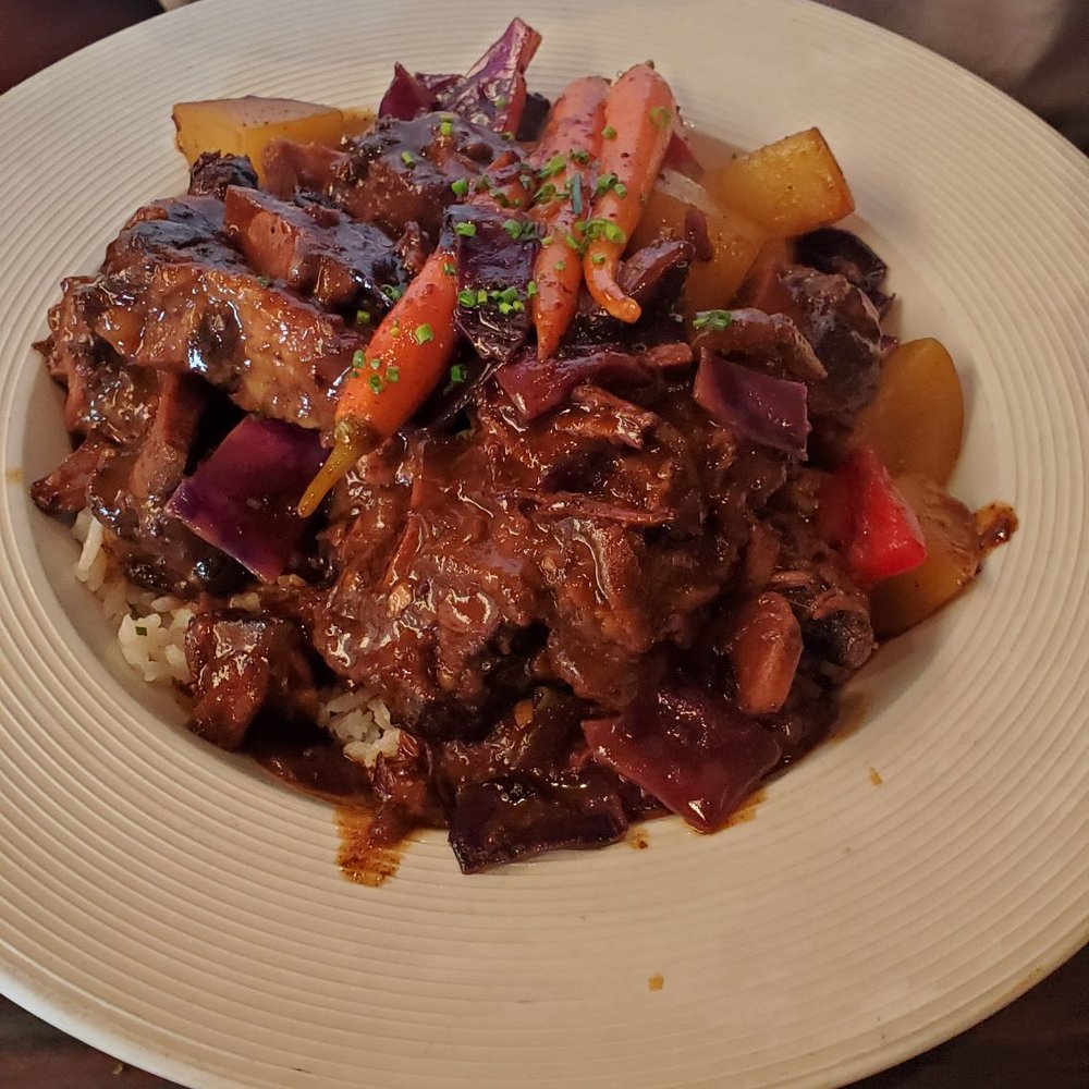 Sisserou's Caribbean Restaurant & Catering - Ox tail stew - Caribbean Near Me - Tulsa, Oklahoma Sisserou's Caribbean Restaurant & Catering - Ox tail stew - Caribbean Near Me - Tulsa, Oklahoma