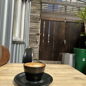 Flywheel Coffee Roasters - Cappuccino in the small veranda in the back - Coffee & Tea Near Me - San Francisco, California Flywheel Coffee Roasters - Cappuccino in the small veranda in the back - Coffee & Tea Near Me - San Francisco, California