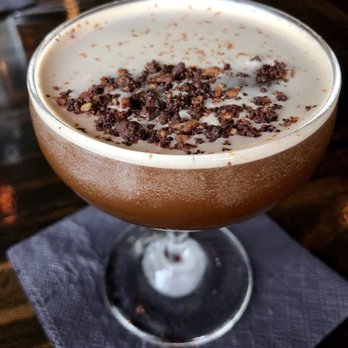 District Kitchen - Anderson Lane - I Like It Alatte: cold brew, molé bitters, ancho reyes, espresso liquor, orgeat. A bit sweet but delicious. - New American Near Me - Austin, Texas