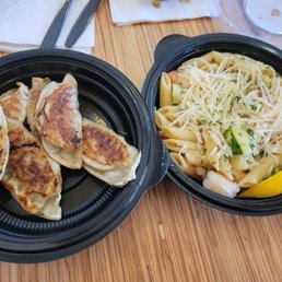 Potstickers aka dumplings and shrimp scampi. Potstickers aka dumplings and shrimp scampi.