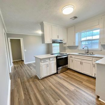 Top Tier Property Group - kitchen and living room - Flooring Near Me - Montgomery, Alabama Top Tier Property Group - kitchen and living room - Flooring Near Me - Montgomery, Alabama