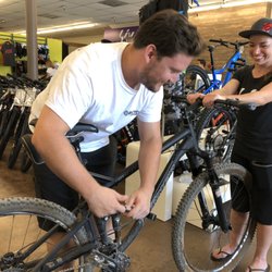 Bicycle Warehouse - Rene and Elise teaching guests suspension set ups
