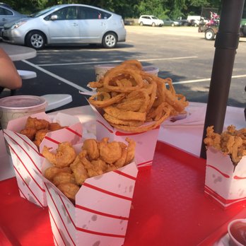 Red Hill Dari - pints of fried food on an outdoor round table near a parking lot - Seafood Near Me - Moultonborough, New Hampshire Red Hill Dari - pints of fried food on an outdoor round table near a parking lot - Seafood Near Me - Moultonborough, New Hampshire
