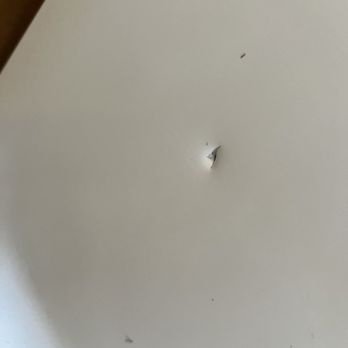 Tiger Construction - Hole they put into the side of our freezer when they moved it - General Contractors Near Me Tiger Construction - Hole they put into the side of our freezer when they moved it - General Contractors Near Me