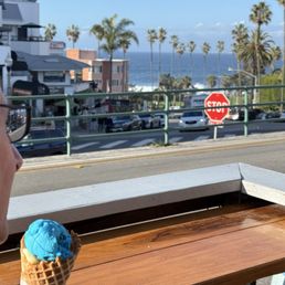 Blue pineapple ice cream and view of sea Blue pineapple ice cream and view of sea