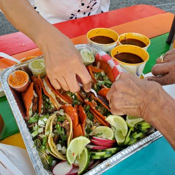 Tacos Don Perez - Carne asada, birria, and tinga de pollo with 3 cups of consomme -- green sauce is hot but the red one is hotter. Consomme is like beef soup. - Food Trucks Near Me - Silver Spring, Maryland Tacos Don Perez - Carne asada, birria, and tinga de pollo with 3 cups of consomme -- green sauce is hot but the red one is hotter. Consomme is like beef soup. - Food Trucks Near Me - Silver Spring, Maryland