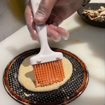 Slidders Pizza - Dressing up the dough Bun before Oven - Pizza Near Me - Orlando, Florida