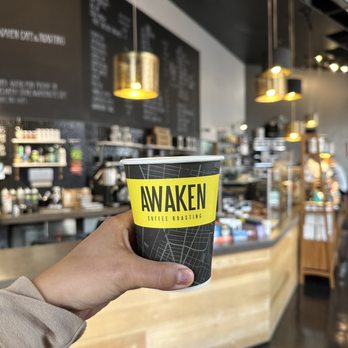 Awaken Cafe & Roasting - 12oz latte (background where you order) - Coffee & Tea Near Me - Oakland, California Awaken Cafe & Roasting - 12oz latte (background where you order) - Coffee & Tea Near Me - Oakland, California