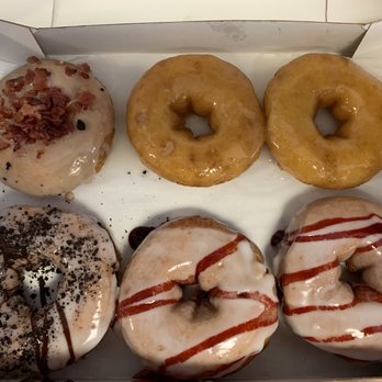 Duck Donuts - Maple bacon, vanilla icing with Oreo crumbles, glazed and vanilla icing with raspberry drizzle - Donuts Near Me - Corolla, North Carolina Duck Donuts - Maple bacon, vanilla icing with Oreo crumbles, glazed and vanilla icing with raspberry drizzle - Donuts Near Me - Corolla, North Carolina