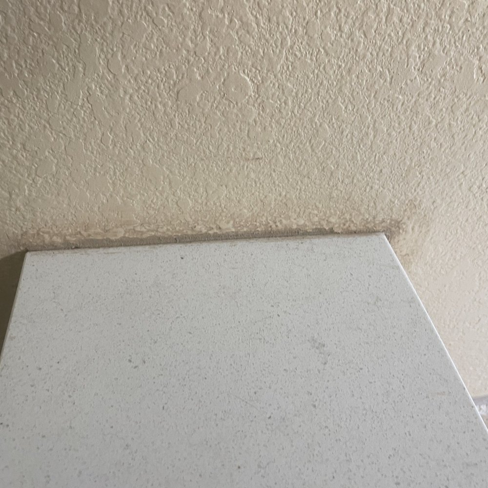 River City Fabricators - Look at the color and how it's on our wall. This is primary bathroom. The quartz is not centered either. Sealant work below is bad. - Countertop Installation Near Me - Wimberley, Texas River City Fabricators - Look at the color and how it's on our wall. This is primary bathroom. The quartz is not centered either. Sealant work below is bad. - Countertop Installation Near Me - Wimberley, Texas