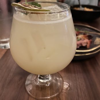 The Moderne - Mother's Mercy Herradura Silver tequila, Ilegal mezcal, Dolin Blanc, spicy ginger, lemon, orgeat (almond), coconut water, mint, lemon spritz - Tapas/Small Plates Near Me - Orlando, Florida