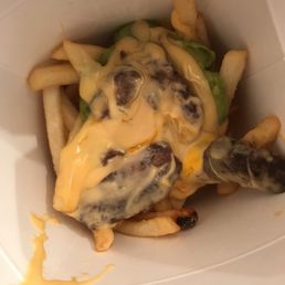 JIB Carne Asada fries with cheese and guacamole. A packet of sour cream is available upon request.