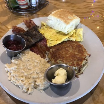 Sunrise Memphis - The Kitchen Sink (biscuit,hash browns,eggs, sausage, bacon, & cheese grits) - Breakfast & Brunch Near Me - Memphis, Tennessee Sunrise Memphis - The Kitchen Sink (biscuit,hash browns,eggs, sausage, bacon, & cheese grits) - Breakfast & Brunch Near Me - Memphis, Tennessee
