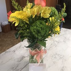 Tharp's Flowers - What arrived. Not even close to expectations, wrong colors, wrong size, missing flowers and box of chocolates.