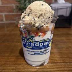 The Meadows Original Frozen Custard - Homemade cookie dough on top w/ caramel sauce and rainbow sprinkles.