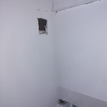 Capital Home Improvements - this is a random hole left in the drywall on the stairs to the attic - Roofing Near Me - Syracuse, New York
