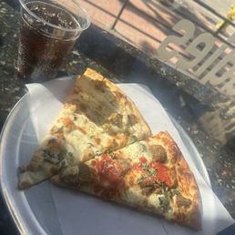 Two Slices of Pizza and Soda for $12 Two Slices of Pizza and Soda for $12