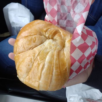 Best Donuts - a person holding a pastry in their hand - Donuts Near Me - Cabot, Arkansas Best Donuts - a person holding a pastry in their hand - Donuts Near Me - Cabot, Arkansas