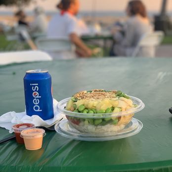 Poke Kai - a plate of food and a can of beer on a table - Hawaiian Near Me - Long Beach, California Poke Kai - a plate of food and a can of beer on a table - Hawaiian Near Me - Long Beach, California