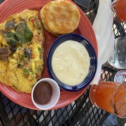 Build your omelette, salmon, spinach, onions and peppers with grits and homemade biscuits