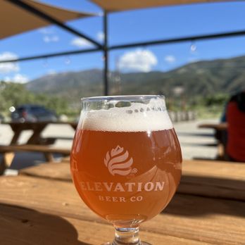 Elevation Beer Co - a glass of beer on a table - Breweries Near Me - Poncha Springs, Colorado